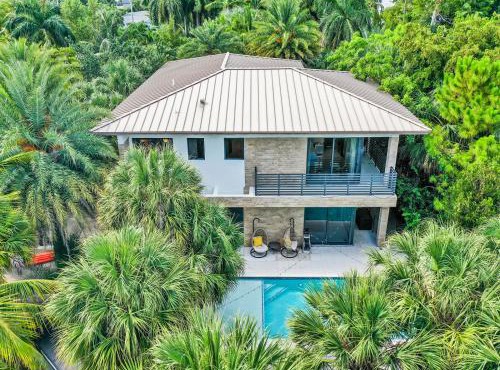 Experience Warmth & Comfort in our Stylish Balinese Waterfront Home