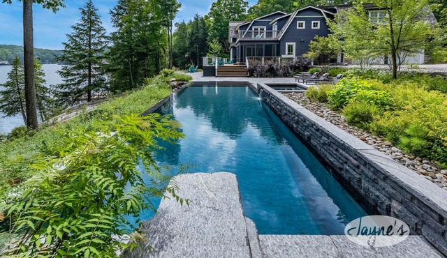 Exquisite 8 bed, 7 bath cottage on Lake Joseph boasting infinity pool + hot tub!