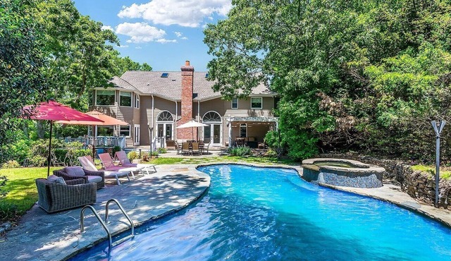 Exquisite Southampton estate with a private heated pool and expansive.