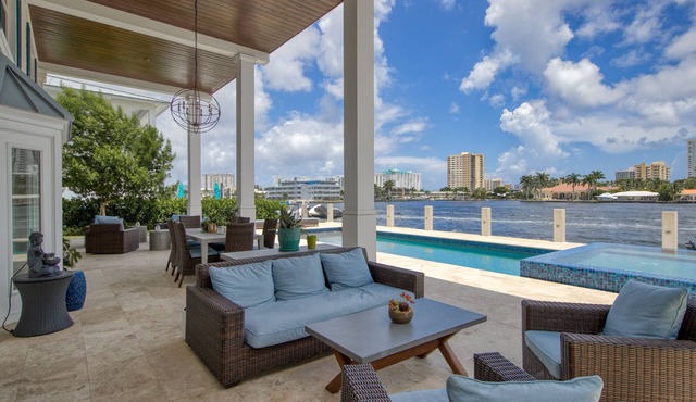 Exquisite waterfront home with a pool, large yard, & grill - close to the beach