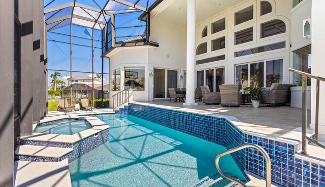 Exquisite waterfront home with lanai, heated pool and spa(hot tub), and internet