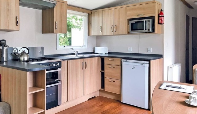 Extra spacious luxury 12ft-wide caravan with one double and one twin.