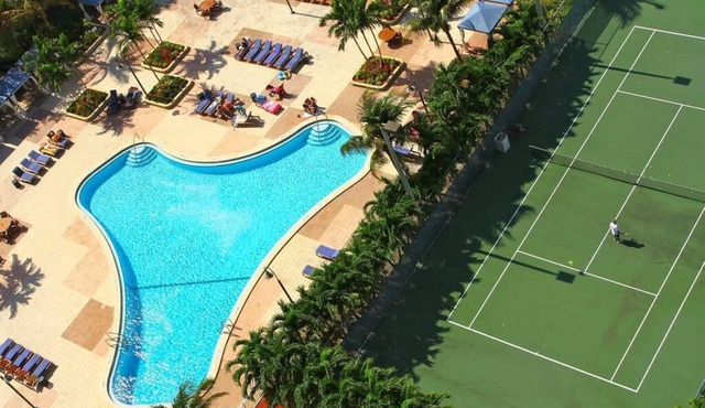 F- Beautiful view of pool and gardens! Walk to beach!