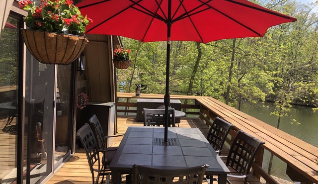 Fabulous chalet surrounded by a lake with rocked shoreline for water fun!