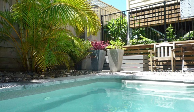 Family beach house with pool and covered outdoor lounge area