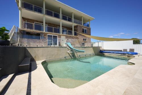 Family Coastal Retreat with Pool and Balcony Views