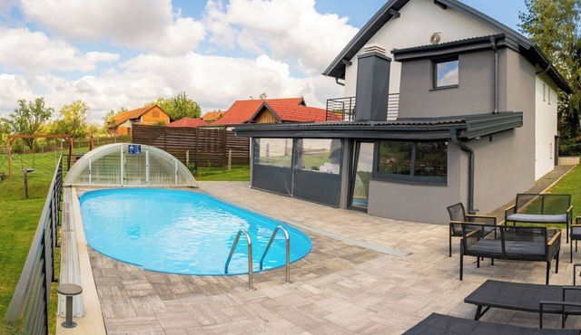 Family-friendly hillside villa with pool, jacuzzi, sauna, terrace, and scenic Medvednica views.