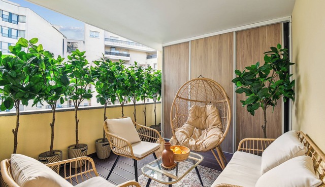 Family-friendly 3BR/2BA Courbevoie apartment w/patio near La Défense metro stop