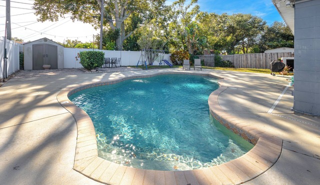 Family friendly 4-bedroom home with heated pool!