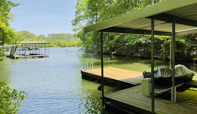 Family friendly lake front home with private dock in a cove