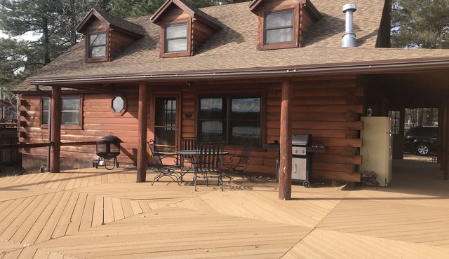 Family Friendly Lakefront Cedar Log Cabin on 2 acres at Rainbow Lake.
