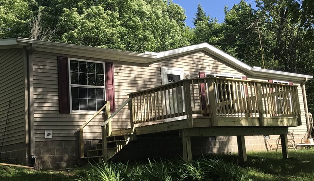 Family home at end of road on small, quiet lake.