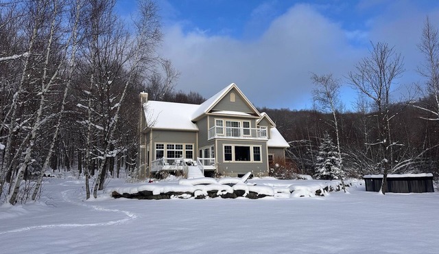 Family home in beautiful forested mountain on serene lake