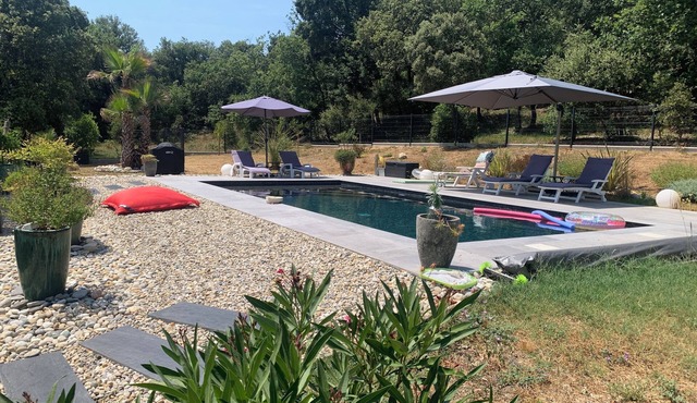 Family home surrounded by a lovely, peaceful setting with swimming pool