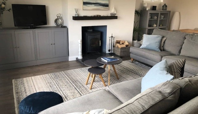 Family Home with stunning beach and mountain views.