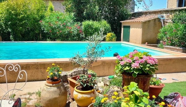 Family house with swimming pool in a charming village