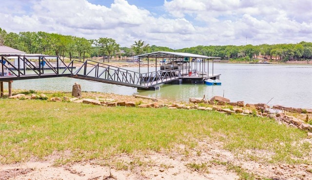 Family lake front home with dock, kayak, outdoor kitchen and more