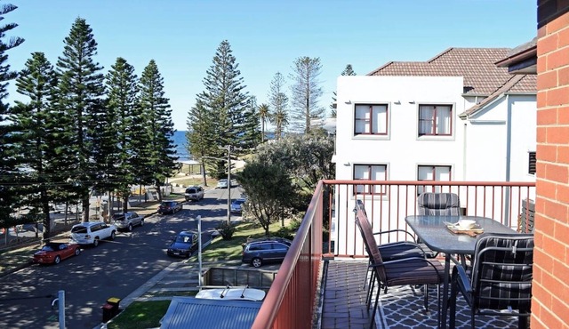 Family Retreat w Balcony Footsteps From the Sand