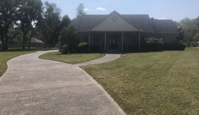 Family style one level home with a modern flair on a one acre lot.