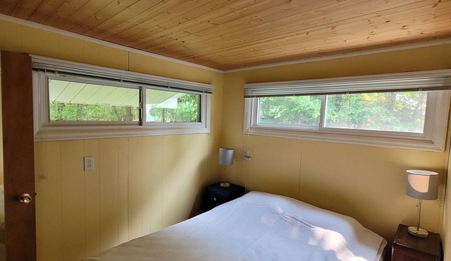 Family waterfront cottage with shallow, sandy entry - drive in, road access.