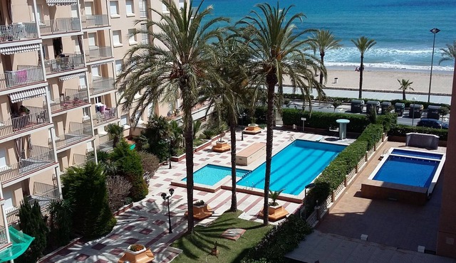 Fantastic apartment on the seafront with 2 swimming pools and garden area