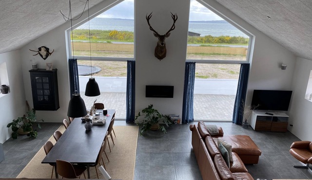 Fantastic home in Ebeltoft with 180 degree sea view and unique living space.
