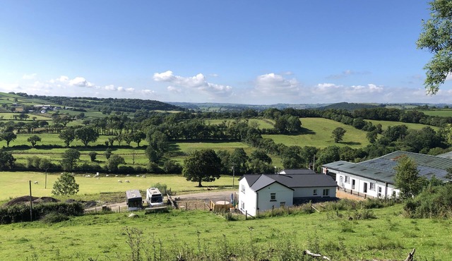 Farm setting with large living areas and wood fired hot tub