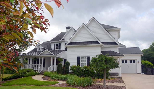 Farm Style home with a pool and game room to stretch out and have family fun.