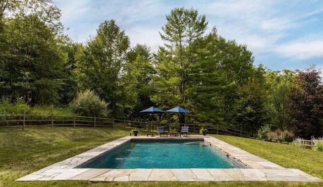 Farmhouse retreat with private pool, outdoor shower, fire pit.