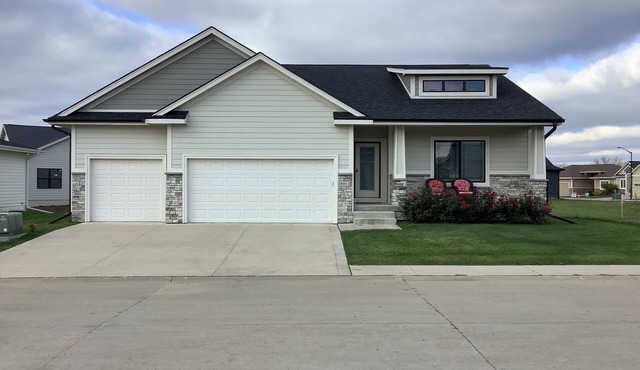 Farmhouse style Villa with front porch, 4 bedroom, 3 baths, and 2 living areas