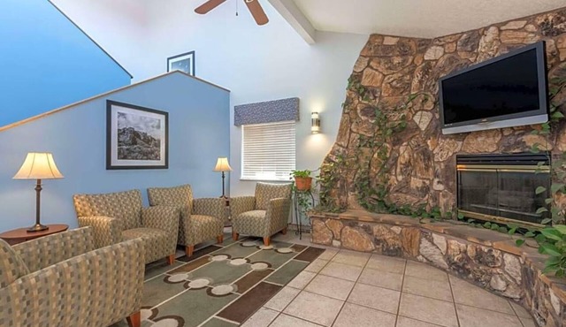 Featuring a year round indoor pool and a hot tub .
