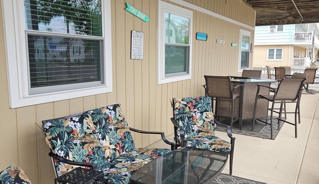 FEEL THE OCEAN BREEZE ON THE LARGE PORCH WHILE ENJOYING YOUR FAVORITE BEVERAGE