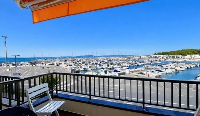 Feel the sea breeze from your balcony overlooking the port.