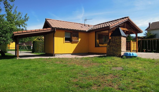 Fenced cottage rental with barbecue and children's play area