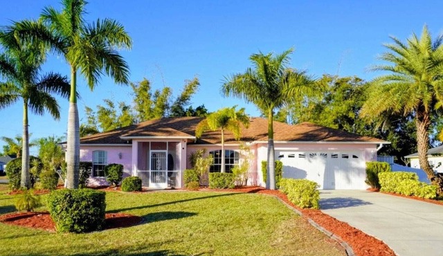 Fenced, private, family friendly villa with exotic poolside views near airport.
