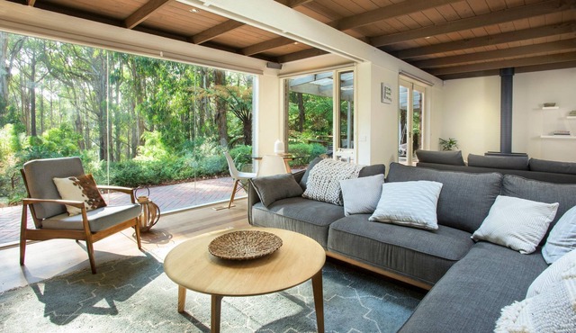 Fernview On Falls - This three-bedroom house is filled with light and surrounded by tall trees, and native gardens.