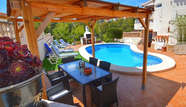Fiesta~Siesta in this easy to access Moraira home with unique bedrooms and BBQ