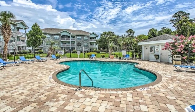 First Floor Updated Coastal Summer Retreat at Magnolia Place - Pool View