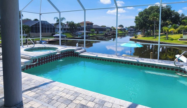 Five Star 3bd Waterfront Canal Home w/Private Pool/Spa & Boat Dock.