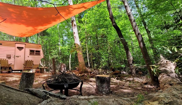 Foraging Orange vintage 60's camper near Rafting