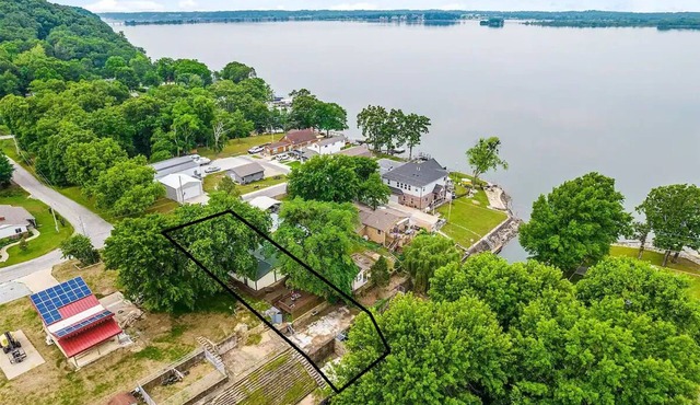 Forget your worries in this spacious and serene lake house in the woods