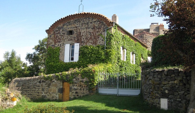 Former priory with garden, located above the village