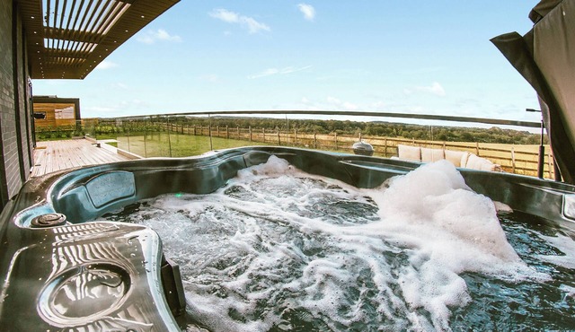 Four bed lodge with three king-size beds and one twin (king by arrangement).