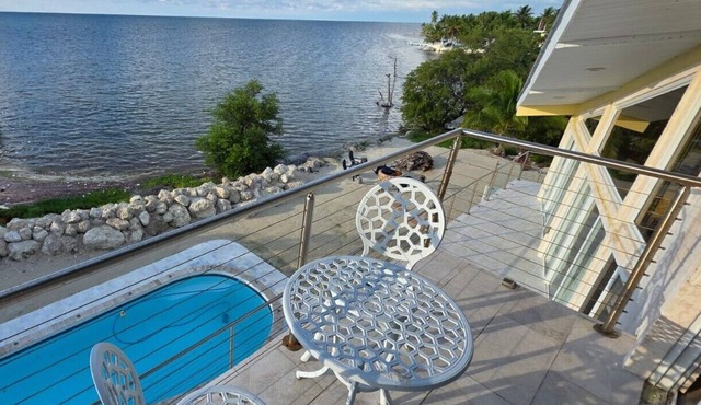 Four-bedroom beach house with oceanfront pool and smokeless bonfire area