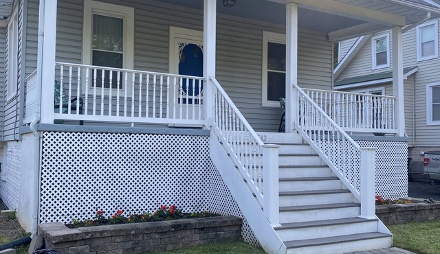 Four bedrooms, porch and parking! Pet-friendly with a large fenced yard.