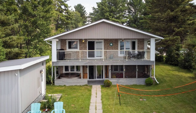 Four Season Serene Lake House with Stunning Lake Views, Private Dock and Sauna.