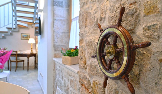 Frantoio House. Charming stone house in front of the dock