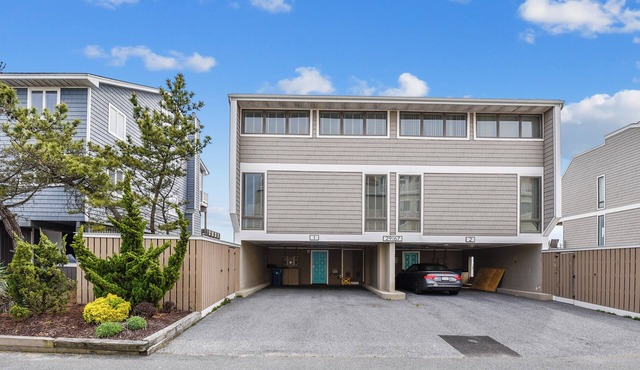 FREE ACTIVITIES! Just steps from the deck to the beach. Beautifully decorated 5 bedroom, 3 bath townhouse with all amenities, central air conditioning, washer/dryer, dishwasher, 2 oceanfront decks.