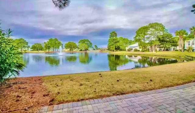 FREE GOLF CART! Stocked Lake w/amazing views! 5 Mins. To Dining, Beach & pool.