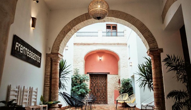 FRENTEABASTOS Suites Cafe Hostal & Apartments